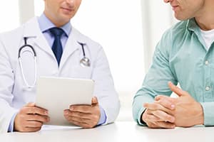 man talking to doctor at an LSD rehab center